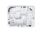 Modern white Repose spa with three ergonomic loungers and hydrotherapy jets, showcasing luxurious interior - Passion Spas Pure Collection