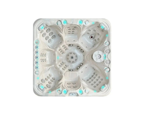 Witte 7-persoons jacuzzi met lichtblauwe ledverlichting en meerdere zitplaatsen, ideaal als swimspa voor buitengebruik.