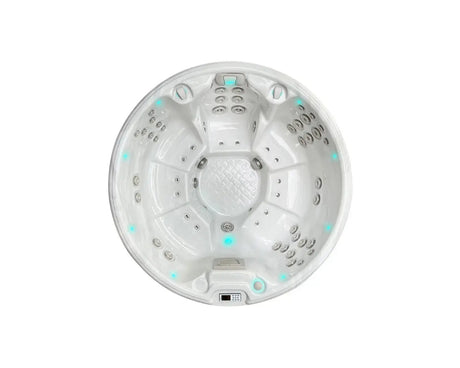 Ronde witte 7-persoons jacuzzi met meerdere jets en ingebouwde bedieningspanelen, perfect als swimspa of zwemspa voor buiten.