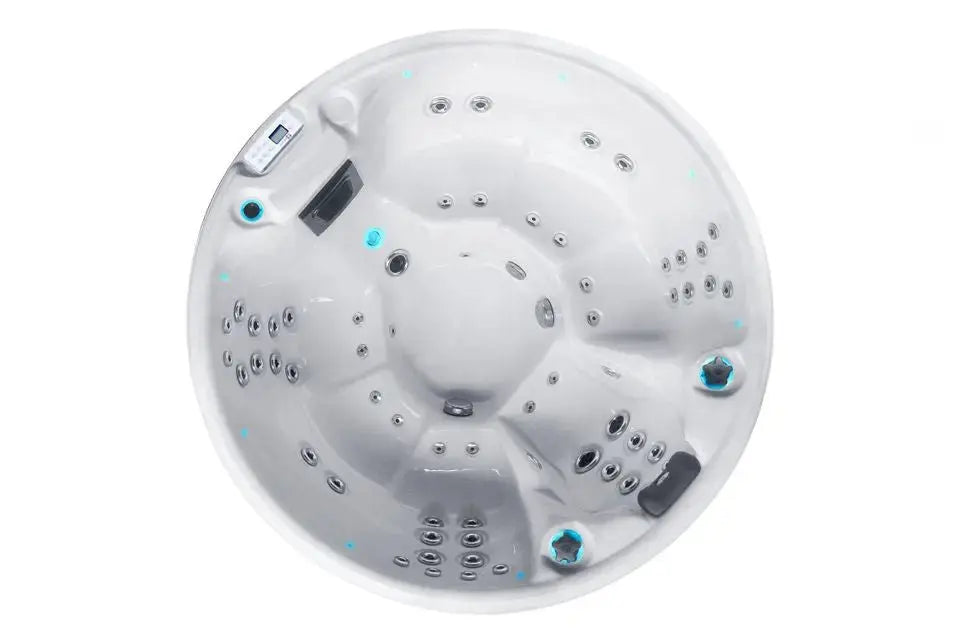Ronde witte jacuzzi buiten met 7 zitplaatsen en meerdere massagestralen, perfect voor swimspa en zwemspa.