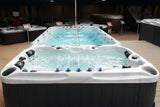 Fitness 1 Deep swim spa with Current-Lift jets and rowing gear displayed in showroom - Passion Spas Fitness Collection