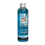 Transparante fles met blauwe aromatherapie-olie Sea and Happyness voor jacuzzi kopen of swimspa gebruik buiten.
